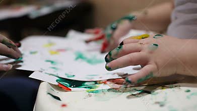 Mother and her child painting.