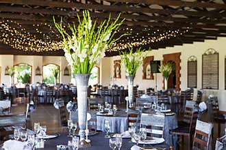 Wedding reception venue with decorated tables and fairy lights