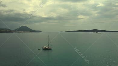 Aerial beach view with luxury yacht at blue sea
