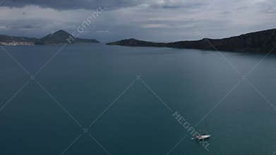 Aerial beach view with luxury yacht at blue sea