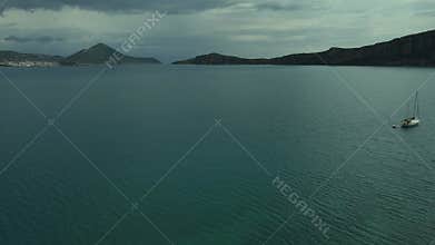 Aerial beach view with luxury yacht at blue sea