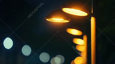 A street light shines bright at night, suitable for use in urban or nighttime scenes