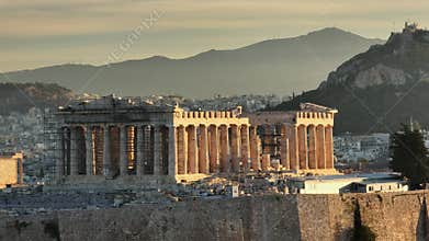 Ancient Parthenon at sunrise in Athens, Greece with panoramic views of the Acropolis and surrounding hills. Aerial