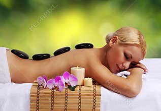 Spa Stone Massage. Blonde Woman