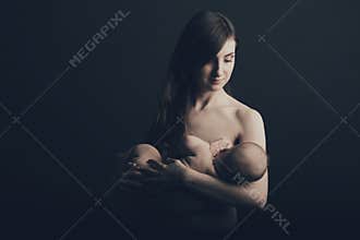 Mother breast feeding her infant
