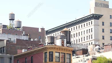 New York City Broadway, Manhattan midtown Union Square building architecture. Rooftop water tower.