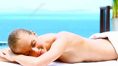 Pretty girl taking spa refreshment