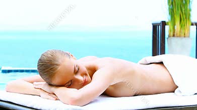 Beautiful woman relaxing in outdoor spa