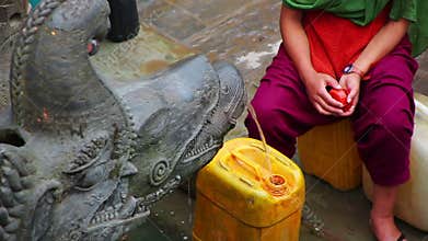 people pouring water container from public fountain