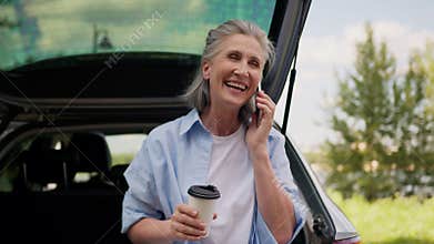 Joyful smiling Caucasian senior elderly laughing woman mature female business woman freelancer pensioner tourist auto