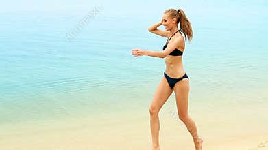 Adorable woman having fun on the beach