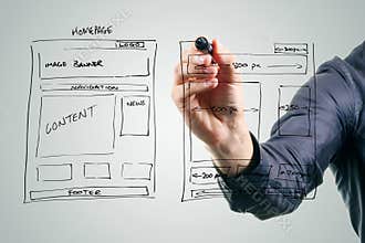 Designer drawing website development wireframe