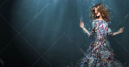 Immersion. Woman in Deep Blue Sea. Fantasy