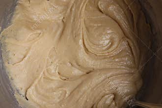 Raw cookie batter in mixing bowl