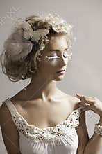 Portrait of beautiful fantasy fairy woman in white