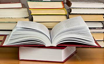 A pile of books with library on the back