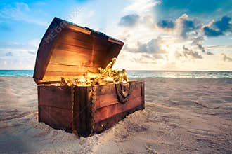 Open treasure chest on the beach