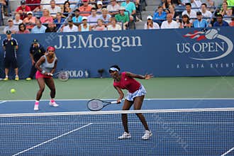 Grand Slam champions Serena Williams and Venus Williams during doubles match at US Open 2014