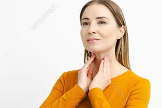 Woman self touching her neck to check the thyroid gland. Prevention and disease of endocrine system
