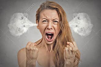 Angry young woman steam coming out of ears screaming