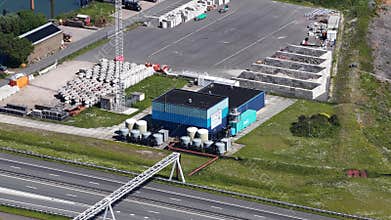 Breezanddijk, 30th of May 2026, The Netherlands. Aerial view of a highway next to an industrial facility