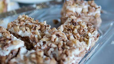 honey cake slices on glass plate with nuts buffet dessert close up