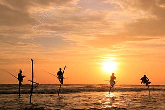 Silhouette of fishermen at sunset, Unawatuna, Sri Lanka