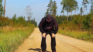 Fat man running along the forest path