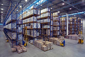Palletising with foodstuffs stand on a rack shelf goods warehouse.