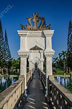 Decorative White Temple Portal Framed by Tropical Trees