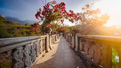Decorative Stone Bridge Lined With Blooming Flowers