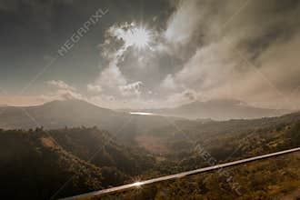 Dramatic Sun Rays Above Tropical Mountain Landscape