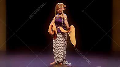 Traditional Female Performer Holding Ceremonial Cloth on Stage