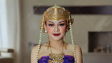 Front Portrait of Traditional Woman Wearing Ornate Cultural Headdress