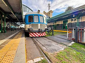 Old tracks and motor coach at the station in City of La Plata Argentina