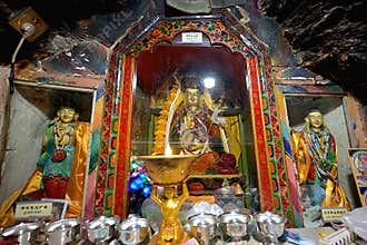 Revered Guru Nadrama statue of Padmasambhava in his meditation cave, flanked by images of Mandarava & Yeshe Tsogyal, Chiu Gompa