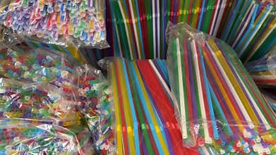 Colorful plastic drinking straws for cocktails and soft drinks isolated on white background