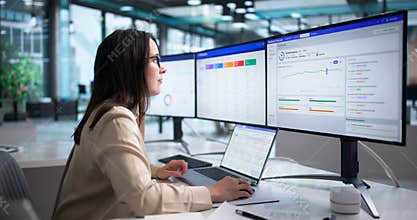 Young Woman Studying Client Data On Laptop