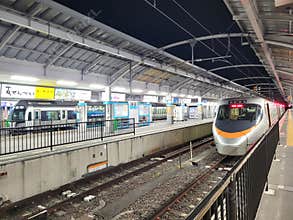 Two trains waiting at Takamatsu station