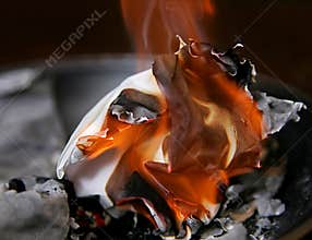 Burning paper ash