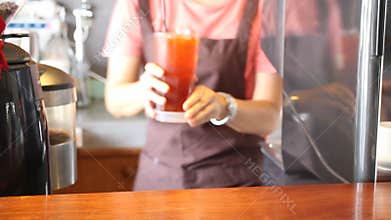 Barista Serving A Glass Of Iced Lemon Tea