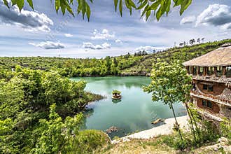 BULGARIA: Scenic river landscape with traditional stone house on bank
