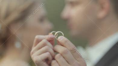 The newlyweds show their wedding gold rings
