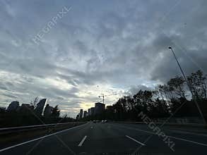 Driving on A10 Ring Road at Golden Hour Through Amsterdam Zuidas Business