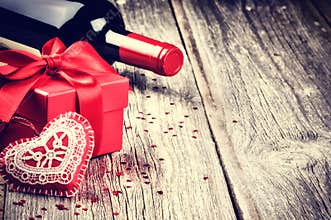 St Valentine's setting with present and red wine
