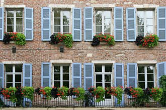The shutters of an old stone house situated in Cahors, France, were painted in blue