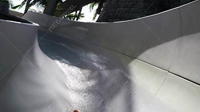 Waterslide at vacation resort aqua park having fun and playing