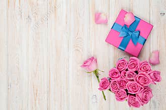 Valentines day background with gift box full of pink roses