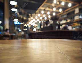Top of Wooden table with Blurred Bar restaurant background