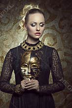 Girl with dark baroque mask